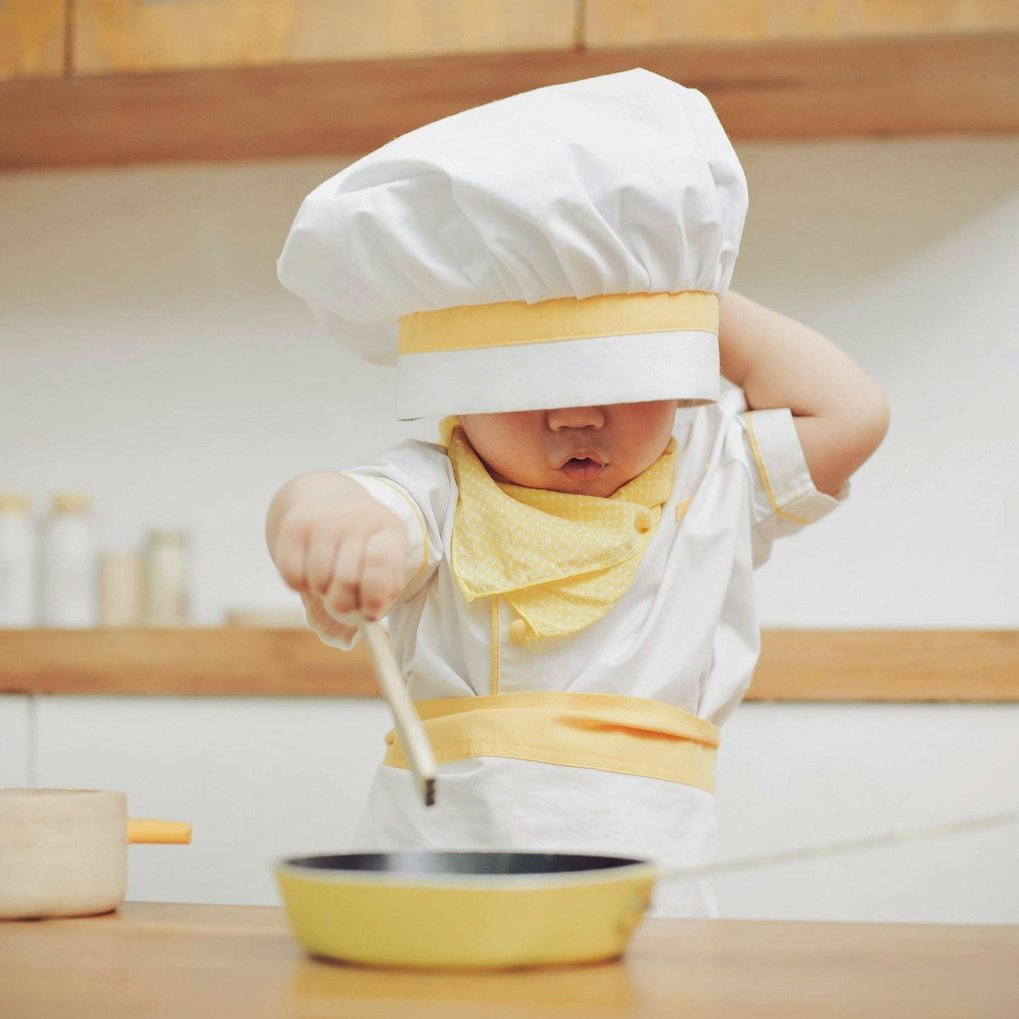 Community members collaborating in a modern kitchen space, sharing recipes and cooking techniques